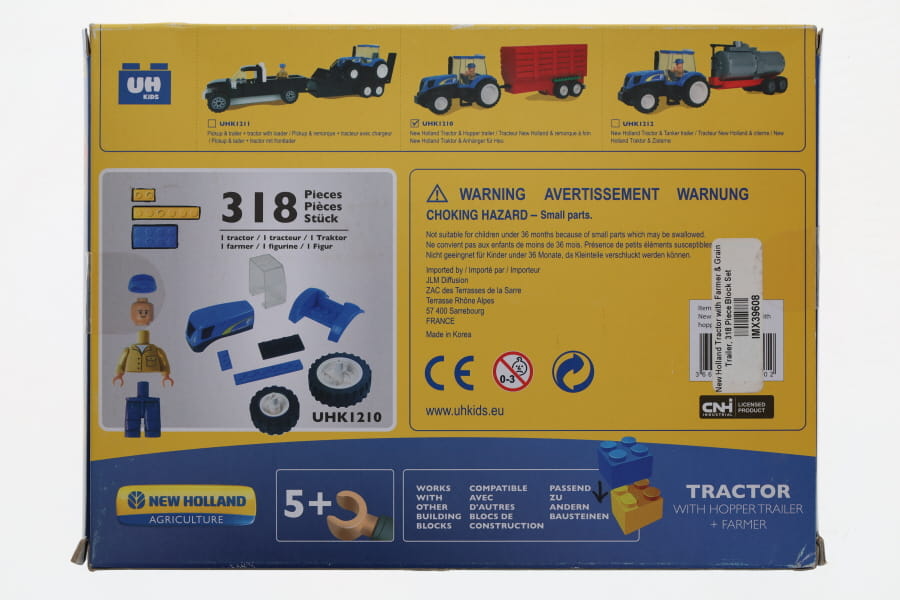 #IMX39608 New Holland Tractor With Farmer & Grain Trailer, 318 Pc Block Set